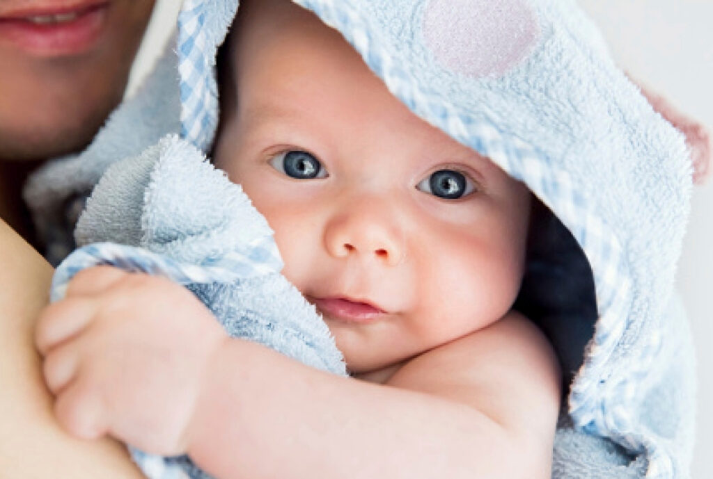 Mom drying baby on arm